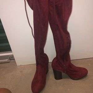 Platform heeled boots with lace up back